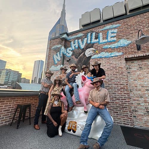 group posing for a photo on the rooftop